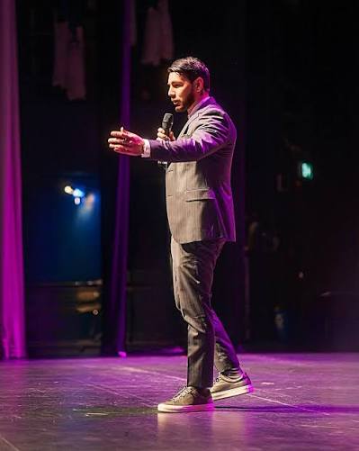 Chris Marchese speaking on stage